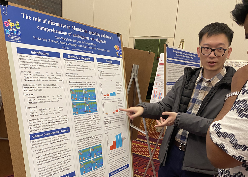 Xuan Wang presenting poster at BUCLD