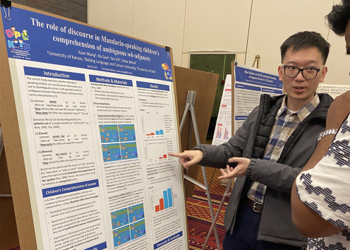 Xuan Wang presenting poster at BUCLD
